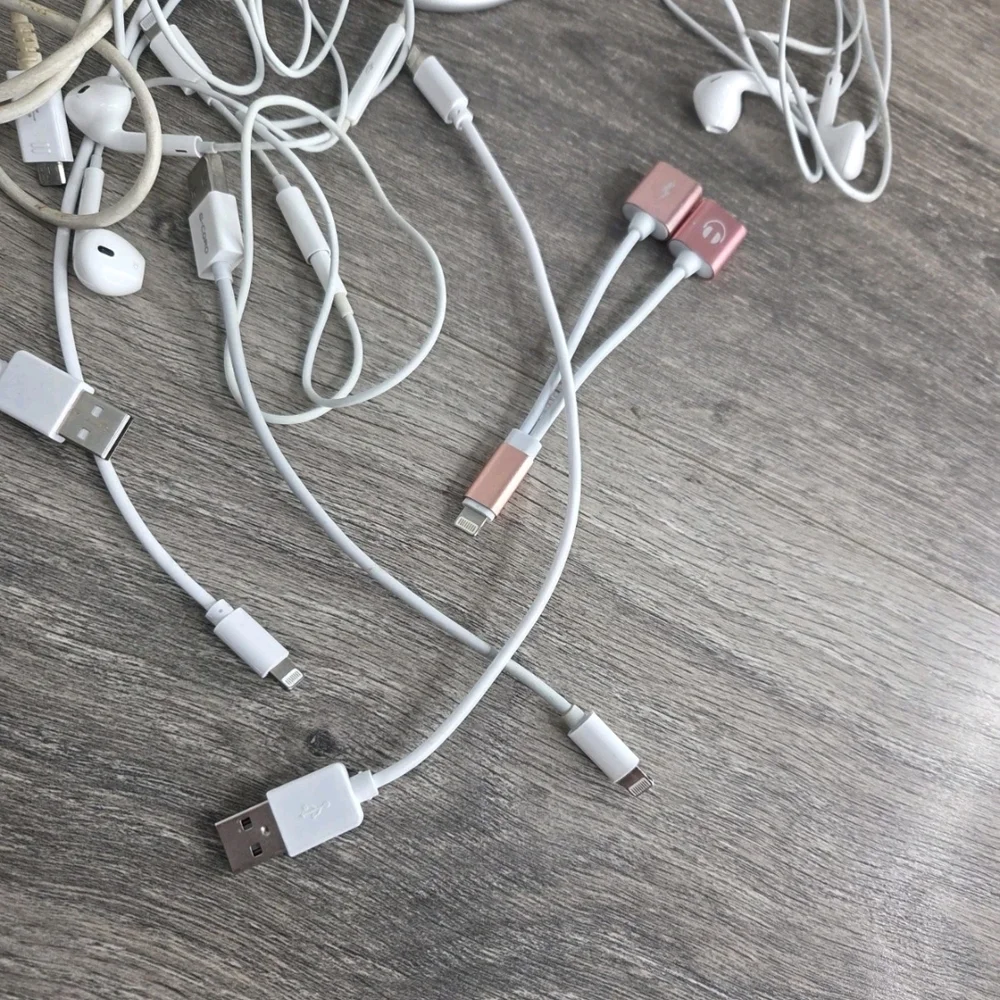 Assorted White and Black Mobile Charging Cables with Pink Accents